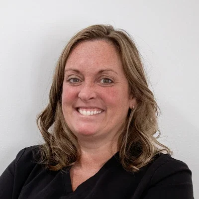 A headshot photo of Christa